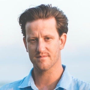 man in blue shirt with a blank background
