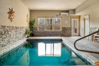 indoor pool with stone walls and art