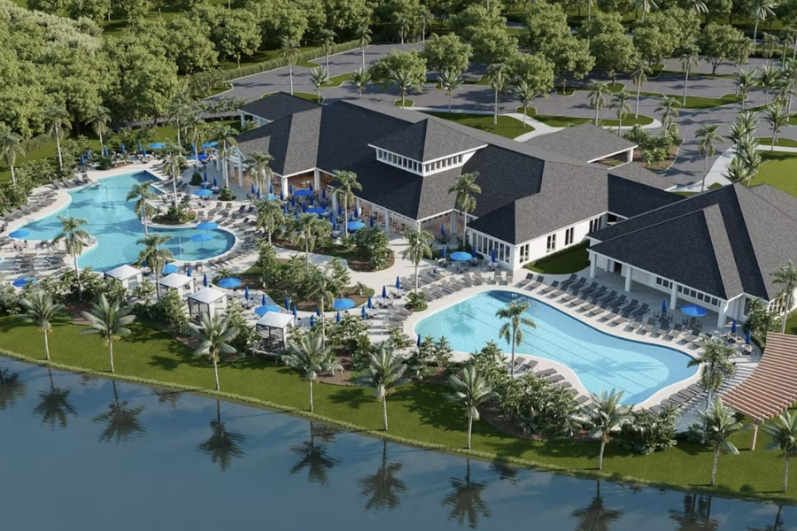 Aerial view rendering of a resort-style clubhouse and swimming pools with palm trees, lounge chairs, and a water feature in the foreground.