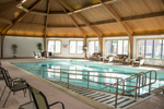 indoor pool with wooden ceiling 